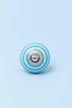 White Striped Hand-Painted Ceramic Cabinet Knob in Grey and Light Blue — close-up view, G Decor