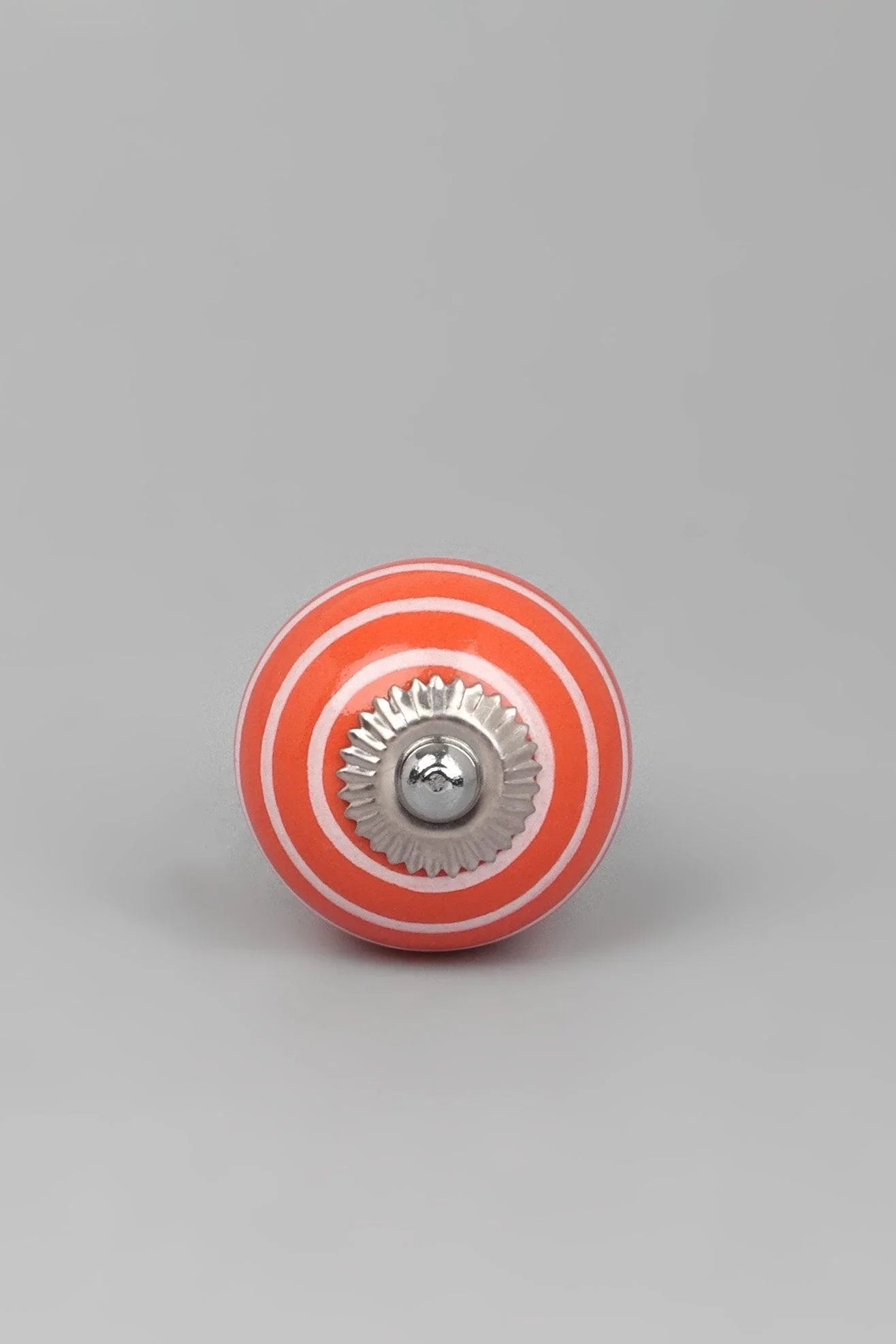 White Striped Ceramic Cabinet Knob in Light Green and Orange — close-up view, G Decor
