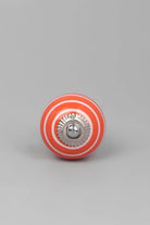 White Striped Ceramic Cabinet Knob in Light Green and Orange — close-up view, G Decor