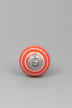 White Striped Ceramic Cabinet Knob in Light Green and Orange — close-up view, G Decor