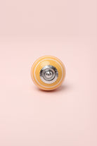 White Striped Handcrafted Ceramic Door Knob In Pink And Yellow Colours - G Decor