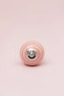 White Striped Ceramic Cabinet Knob in Pastel Pink and Yellow — close-up view, G Decor